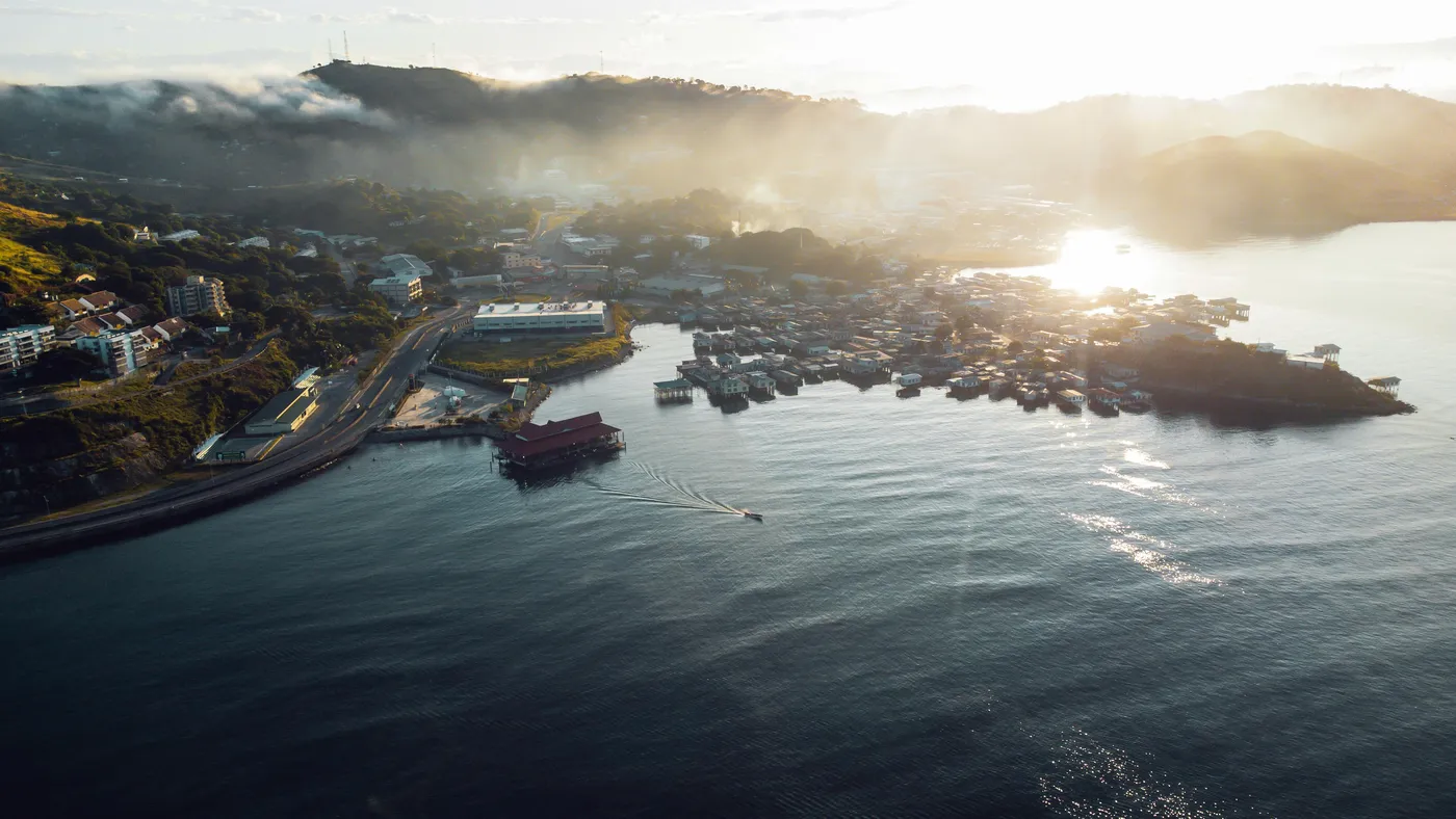 Aerial view of Port Moresby, Papua New Guinea at sunrise — a frontier market where K-Towers works