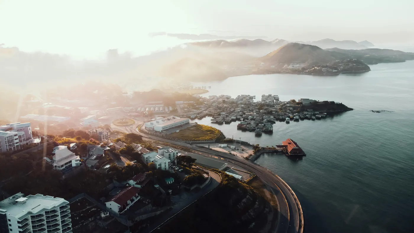 Aerial view of a coastal city where K-Towers operates infrastructure