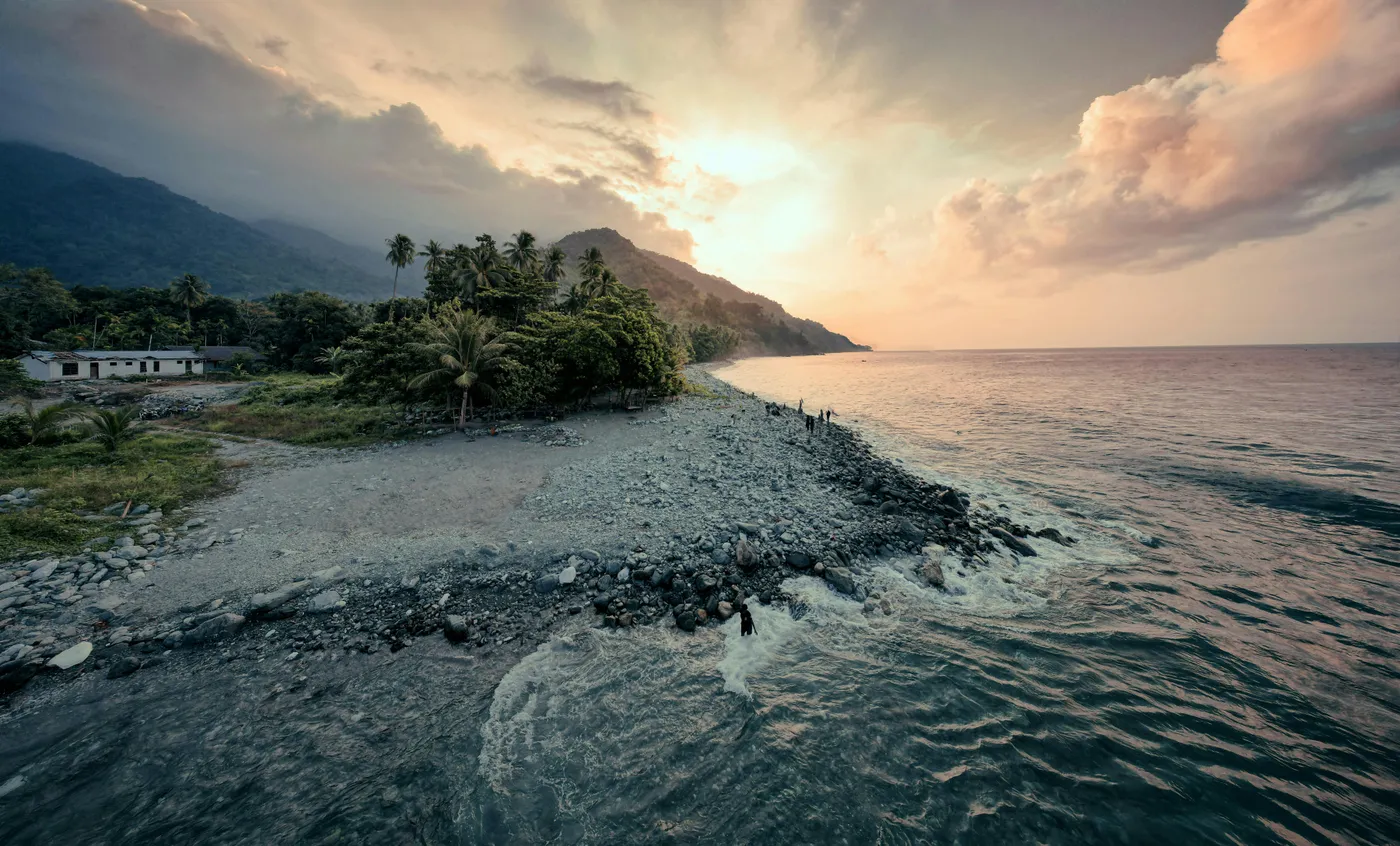 Remote tropical coastline in Papua New Guinea at sunset, a region where K-Towers deploys rural infrastructure